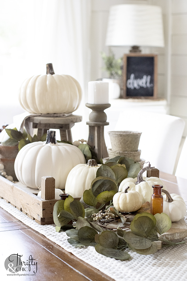 neutral fall tablescape decor, Fall dining room decor, fall table setting. Neutral fall centerpiece. Farmhouse fall dining room. Amber vase, amber bottles