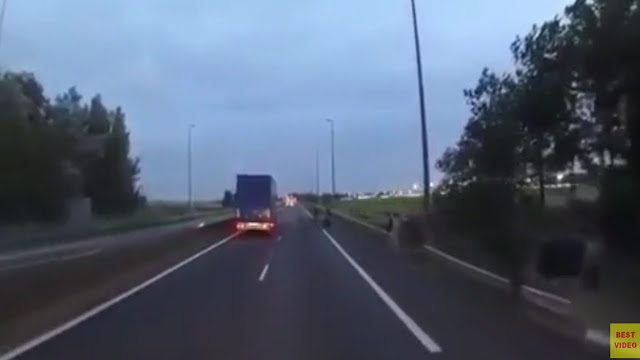 Immgrants trying to stop lorries