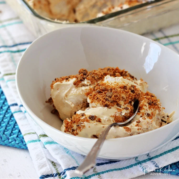 Easy No-Bake Butterfinger Dessert with Angel Food Cake in dish with spoon ready to eat