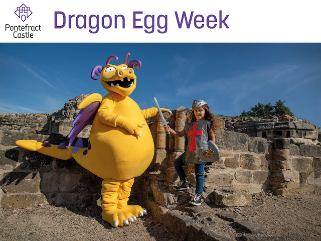 Dragon Egg Week at Pontefract Castle. Includes photo of Ilbert the Dragon and a young visitor dressed as a knight