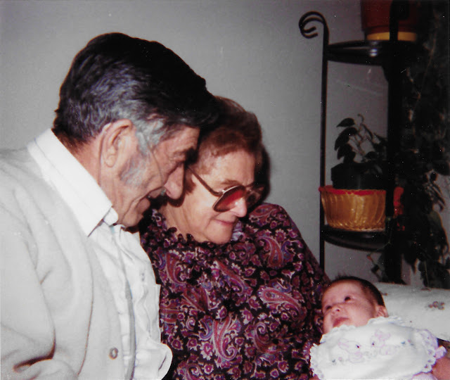 Gerald and Ruth Matherly holding their granddaughter, Adrienne.