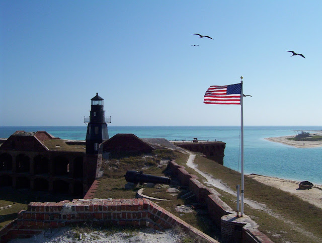 lighthouse and American flag