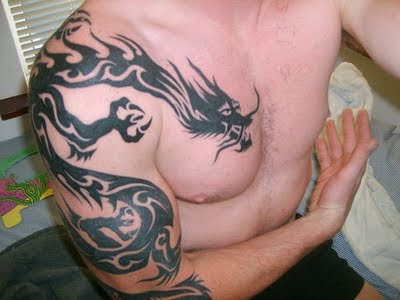 Dragon Tattoo design on Arms and Chest. RANDOM TATTOO QUOTE: "Not one great 