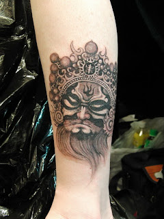 beijing opera face tattoo design on the leg