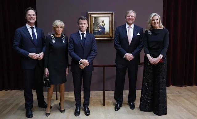 Queen Maxima wore a jaden jacket by Joseph, and red wool coat by Natan. Brigitte Macron wore a blue suit by Louis Vuitton