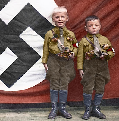 Stealing children's smiles:  How may of these kids understood what Hitler's Nazism was?  How many of the kids in the photos with De Santis understood what Gay, Christian nation or other De Santis topics are?