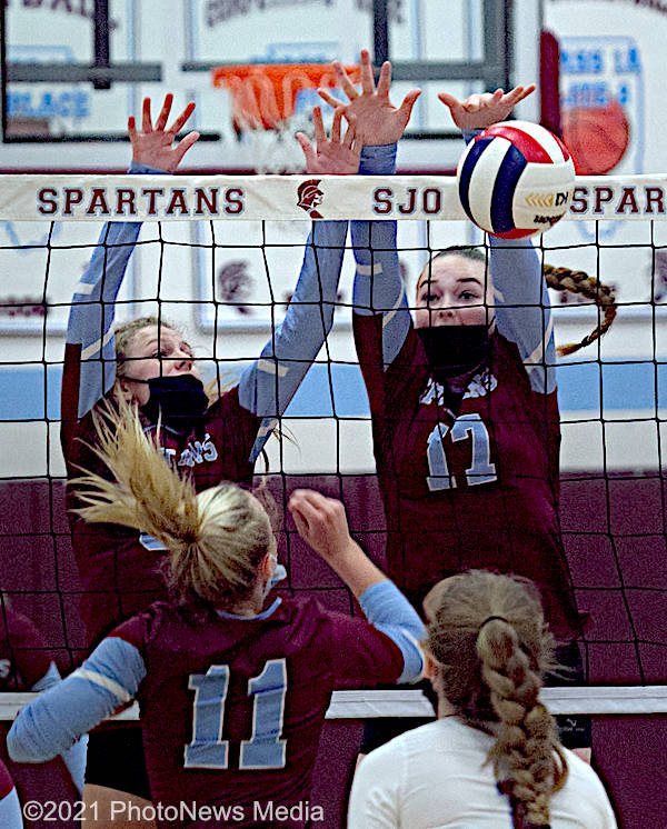 Taylor Wells and Becca Becca Steinbach go up for a block