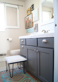Project Kid's Bathroom Makeover - before & after - new tile, painted vanity, gallery wall, wood shelves and  antler organizers.