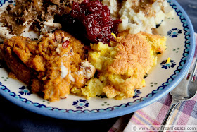 close up of a Thanksgiving plate laden with side dishes including dairy free corn pudding casserole