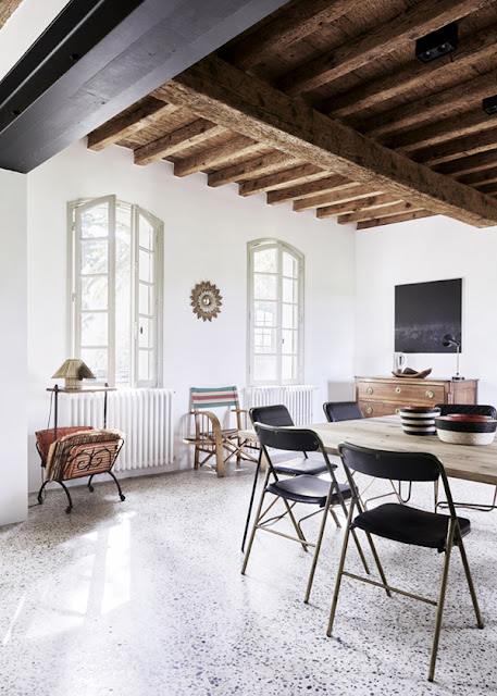 hellolovely-french-farmhouse-black-dining-room-modern-chairs-camargue-france