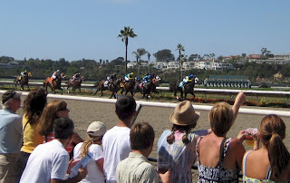 The horses thundering down the finishing stretch.