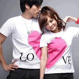 couple with white shirts and pink heart