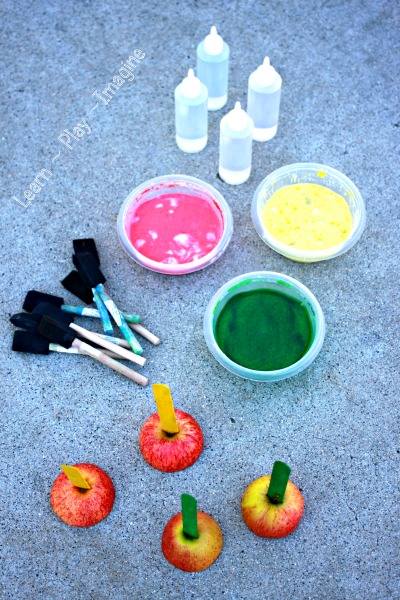 Invitation to make apple prints with sidewalk chalk, and they erupt!