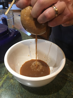 squeezing cider into bowl