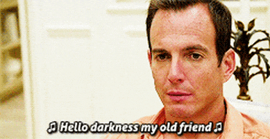 Will Arnett's sad face with the caption "Hello darkness my old friend..."