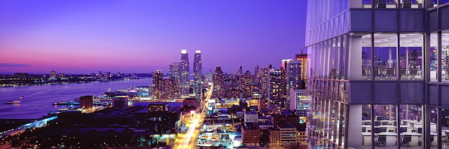 Picture of the north tower facade and Midtown skyline as seen at sunset