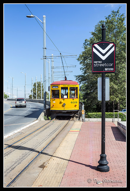 Rock Region Metro Streetcar 409 heads up onto the Main Street Bridge in Little Rock, AR