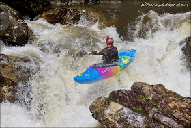 Ty Caldwell launching off of the first ledge at Darwin's Hole, photo by Chris Baer, NC
