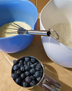 3 Bowls of Pancake ingredients with Whisk
