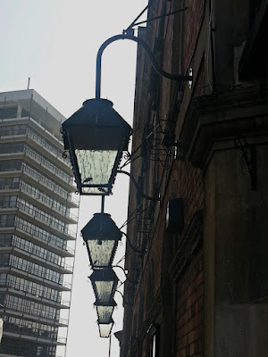 Row of five lanterns hanging outside a building in Bristol