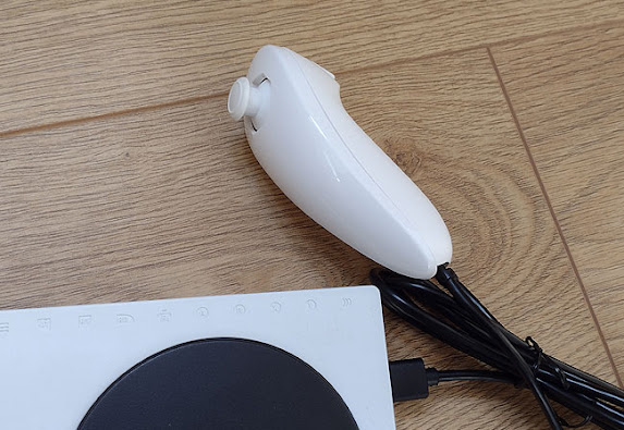 Wii Nunchuk modified to work on an Xbox Adaptive Controller.