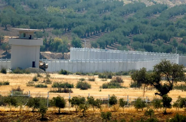 Image Attribute: A wall along the border between Turkey and Syria is pictured near the southeastern town of Deliosman in Kilis province, Turkey, August 29, 2016. REUTERS/Umit Bektas/File Photo