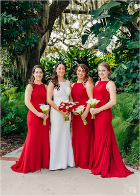 bridesmaids in long red dresses