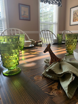 Happiness is green glasses, napkin rings, and a real table.