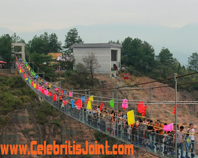 Take a look at the crowd that’s been gathering to walk on the bridge, which is 180 meters above the ground, See photos