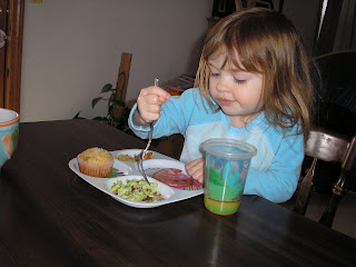 Olivia eating Green Eggs and Ham.  Yes the eggs really are green.