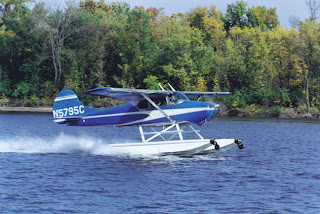 Blue Cessna 170, flying in the water using Blue Cessna 170