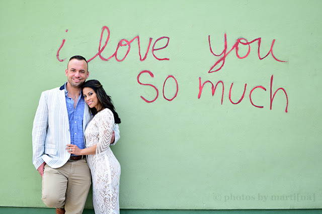 The happy couple at the "I love you so much" wall in Austin, Texas