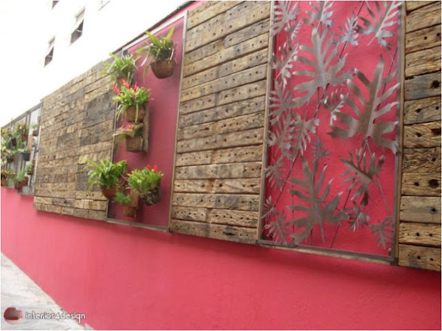 Red wall with plant and wood