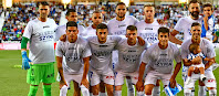 C. D. LEGANÉS. Temporada 2019-20. Pichu Cuéllar, Rosales, En-Nesyri, Braithwaite, Tarín y Siovas; Jonathan Silva, Óscar Rodríguez, Eraso, Bustinza y Rubén Pérez. C. D. LEGANÉS 0 C. ATLÉTICO OSASUNA 1 (Chimy Ávila). 17/08/2019. Campeonato de Liga de 1ª División, jornada 1. Leganés, Madrid, estadio de Butarque. Los jugadores del Leganés portando una camiseta de apoyo al extremo argentino Alexander Szymanowski, lesionado de gravedad.