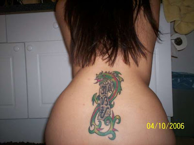 Lower back dragon tattoo