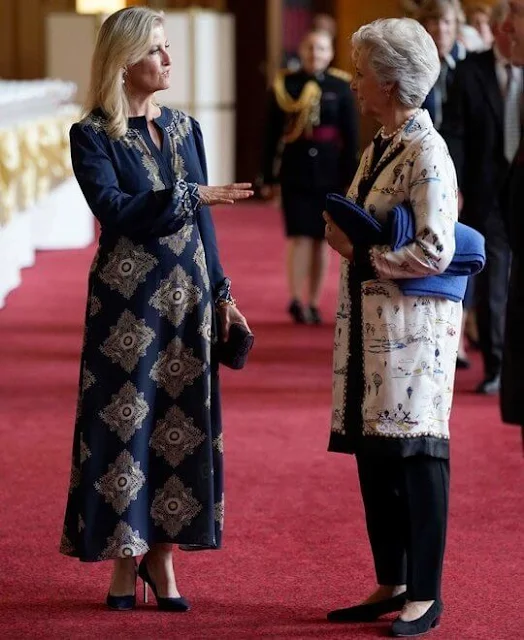 The Duchess of Edinburgh wore a new printed midi dress by Etro. The Duchess of Gloucester wore a printed jacket and black trousers