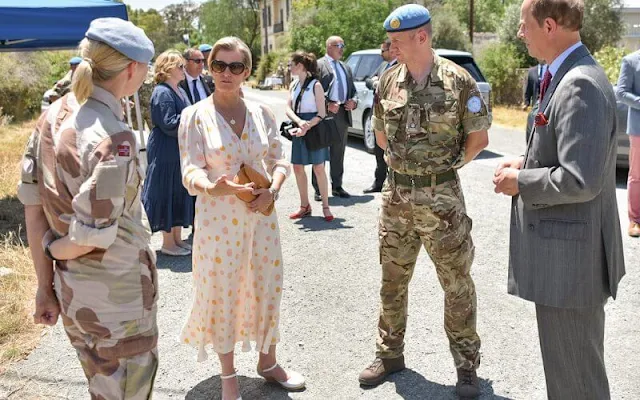 The Countess wore a beige amanda belted maxi dress by ARoss Girl x Soler, and cora polka-dot classic silk tea dress by Suzannah