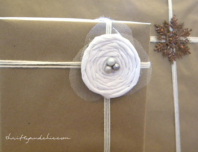 neutrally wrapped presents with kraft paper and yarn