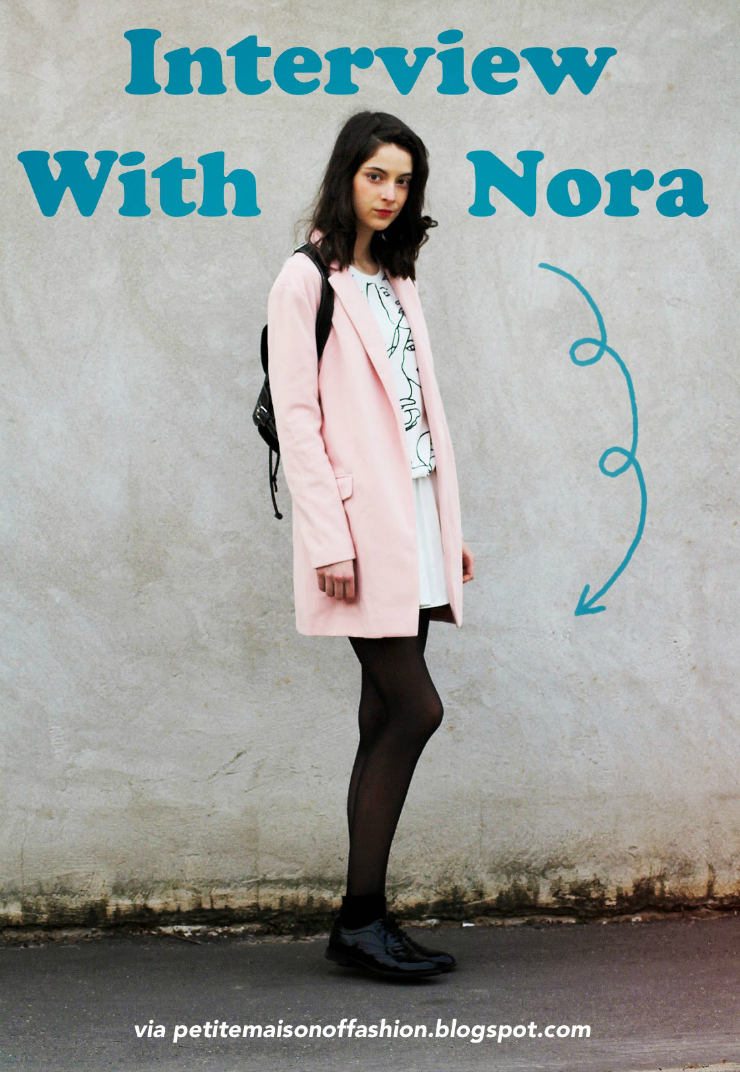 Nora, fashion blogger, wears a cute pastel winter coat