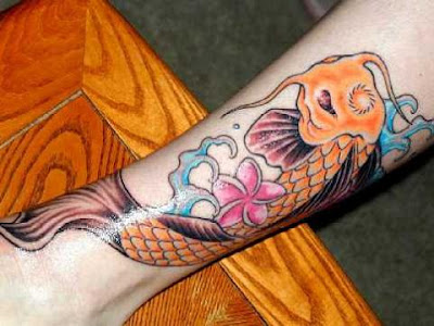 big koi tattoo art design on arm and hand with a very good complexion and 