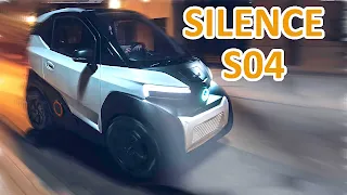 White Silence S04 electric car moving at night, with text overlay.