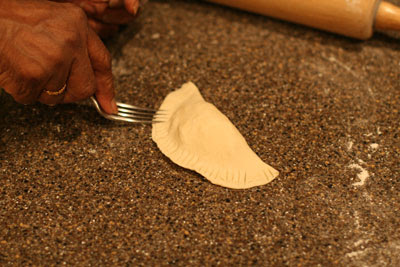 Fold the piece of dough into a half-moon