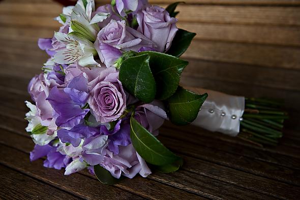 Wedding bouquet for the bride made of lavender roses purple lisianthus