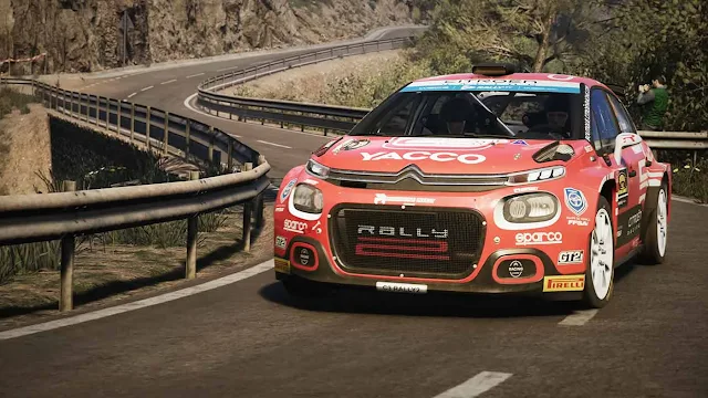 A muddy rally car in EA Sports WRC on PS5, DualSense haptics buzzing.