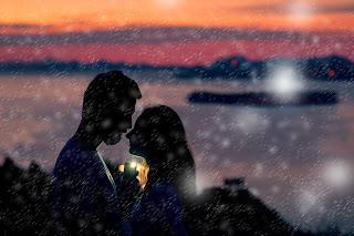 A young man and a girl in the dark in romantic moments