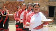 Newari ladies on single file procession visiting temples