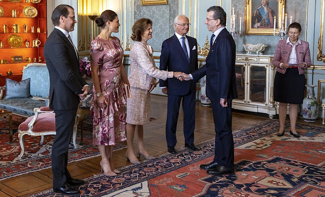 Crown Princess Victoria wore an Ethel floral print ruffled silk satin midi dress from By Malina. Queen silvia wore a tweed jacket and skirt