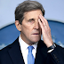 Kerry Caught Not Wearing Mask On Flight. He Claims It Was Only A Moment; Witness Claims That’s Not True.