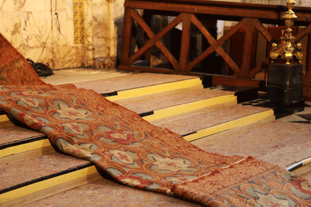 ALTAR RUG BEING INSTALLED