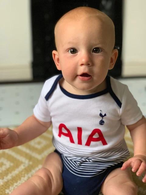 6 month old baby boy wearing a spurs vest bought by his Grandad a big spurs fan